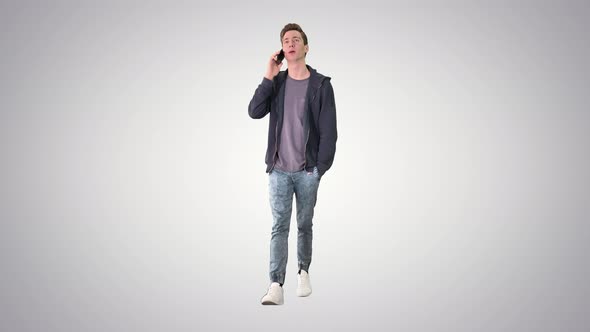 Happy Student Walking and Talking on Mobile Phone on Gradient Background alt