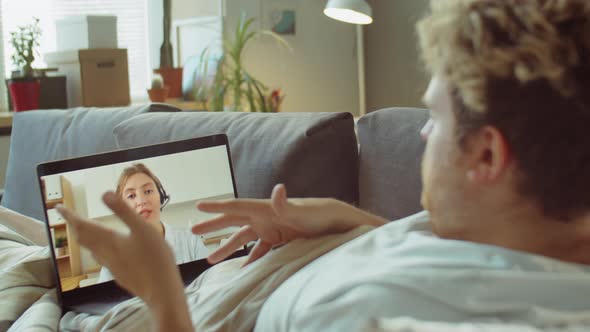 Ill Man Having Online Consultation with Doctor on Video Call alt