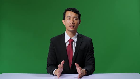 Green Screen Background: Live News Studio With Professional Asian Male Anchor Reporting alt