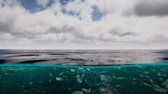 Split View Over and Under Water in the Caribbean Sea with Clouds alt