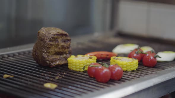 Veal Steak, Tomato Cherry, Corn, Lemon Grass on the Grill Oven alt