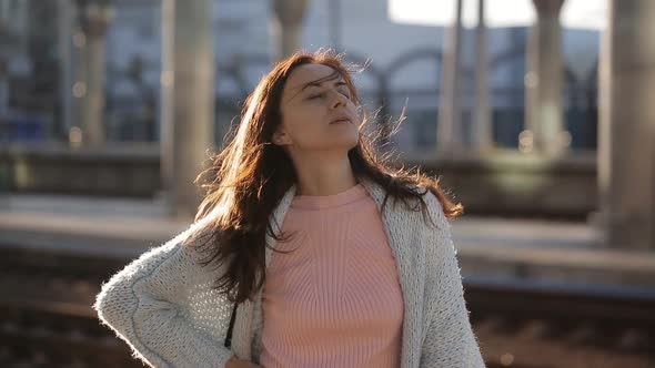 Attractive Woman Waiting the Train on Railway Platform Train Station alt