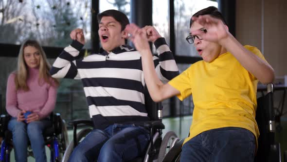 Happy Disabled Boys Rejoicing Winning Bocce Game alt