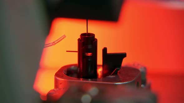 Advanced industrial production line for small parts, robotic arms working alt