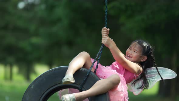 Girl in fairy princess costume on tire swing, shot on Phantom Flex 4K alt