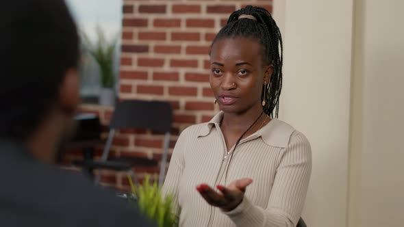 Female Employee Attending Briefing Meeting with Colleagues alt