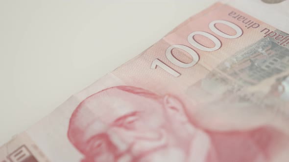 Serbian banknotes on pile slow pan close-up 4K 2160p 30fps UltraHD footage - Panning on denomination alt