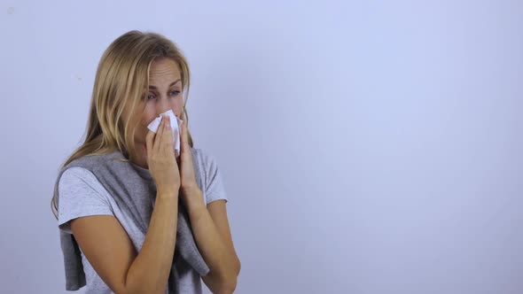 Woman Sick Virus. She Suffers From a Runny Nose, Cough and High Fever