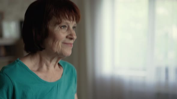 Elderly Woman Running on a Treadmill alt