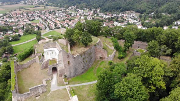 Aerial view of ancient Donaustauf Castle on the hill, Landmark, Fly around castle with zoom in alt