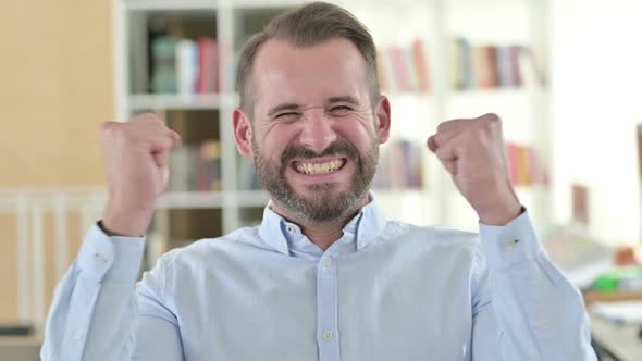 Portrait of Positive Young Man Celebrating Success Joy alt