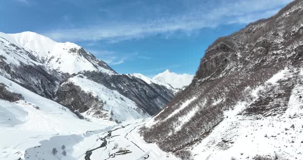Aerial view of beautiful snowy mountains in Gudauri, Georgia alt