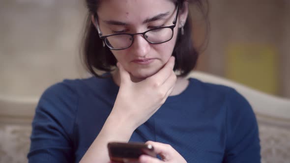 Pensive Girl Uses the Phone Discomfort Not Understanding Deadlock Chat