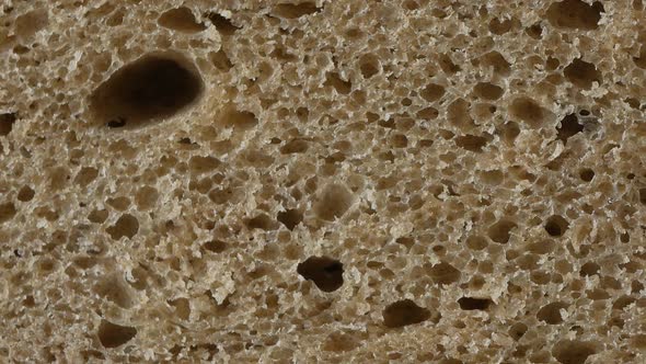A slice of brown bread, up close alt