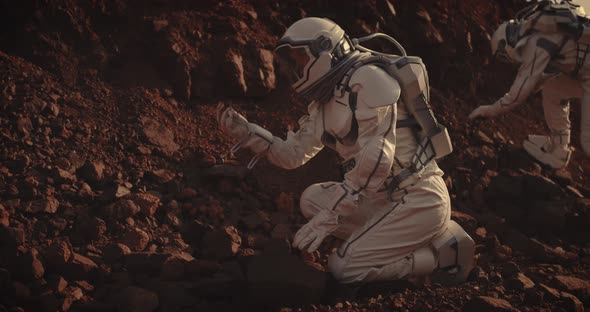 Astronauts Collecting Rock Samples on Mars alt