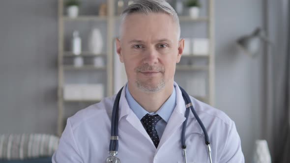 Online Video Chat with Patient By Doctor with Grey Hairs alt