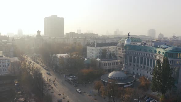 Aerial Fly Over Institutska Street and Kreshchatyk Metro Station at Foggy Weather alt