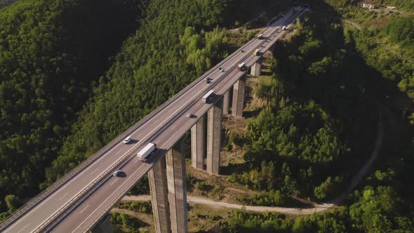 Truck in Traffic on Highway Viaduct Bridge View From Above alt