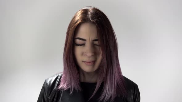 Portrait of Young Woman Screaming Loud Burying Head in Hands and Turning Head alt