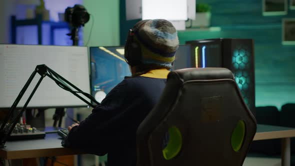 Back Shot of Pro Gamer Woman Playing First Person Video Games alt