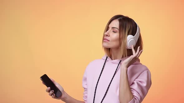 Blonde Woman Dance with Headphones