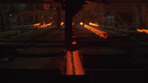 Steel Mill Steel Bars and Pipe Production Redhot Pipes Transported on Production Line Heavy Industry alt