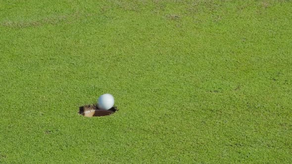 Golf Ball Winning Putt Slow Motion Video alt