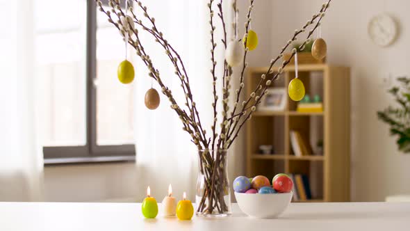 Easter Eggs, Willow and Candles Burning at Home alt