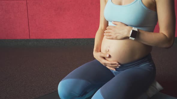 Pregnant Woman Stroking the Abdomen Yoga alt