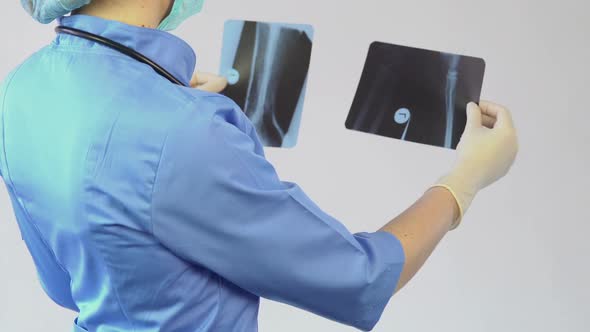 Trauma Surgeon Making a Diagnosis and Treating a Patient in a Private Clinic alt