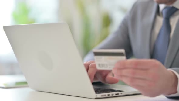 Close Up of Businessman Making Online Payment on Laptop alt