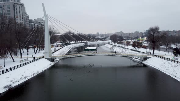 Aerial bridge on winter river in Kharkiv city