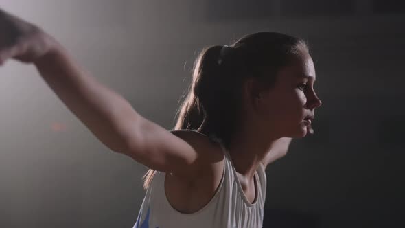 Closeup View of Face of Junior Female Gymnast is Performing Pose During Floor Exercises Sporty alt