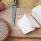 Goat cheese on a wooden cutting board.  - VideoHive Item for Sale