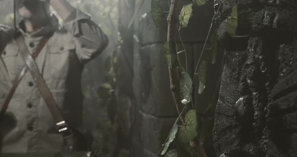 Explorer with binoculars in the jungle