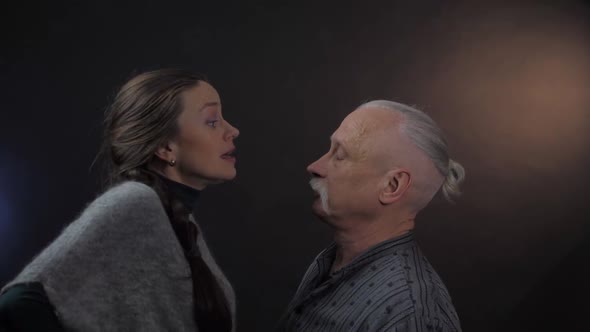 Pretty Woman Blames and Moves Hands Near Scared Pensioner alt