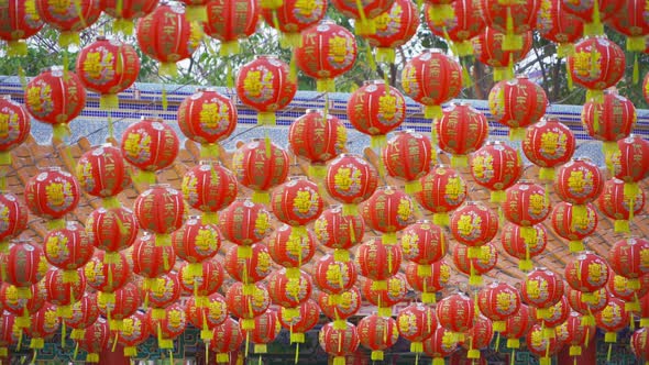 Red chinese lanterns hanging on wire outdoor lamps in temple of China Town decoration