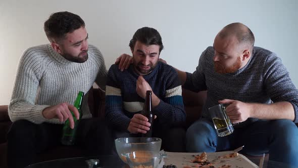Three Male Friends Sitting on Sofa at Home alt