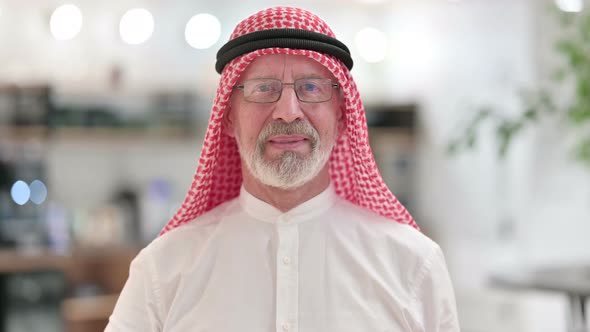 Positive Senior Old Arab Businessman Doing Thumbs Up  alt