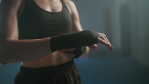 Woman Fighter Wraps Her Hands with Boxing Bandages Kickboxing Training Day in a Gym Female Fighter alt