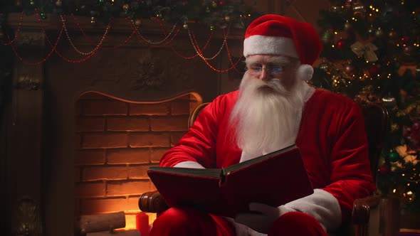 Good Old Santa Claus in His House Next To the Fireplace and Christmas Tree Ready for Christmas alt