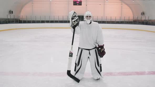 Portrait Of Goalie On Ice Rink alt