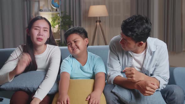 Upset Asian Family Is Frustrated About The Loss Of The Team In Game They Are Watching Tv At Home alt