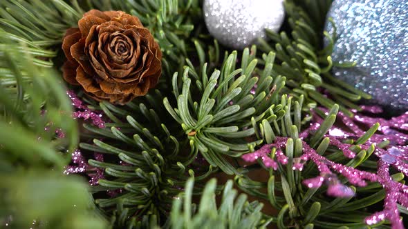 Abies nobilis branch with cones and Christmas balls alt