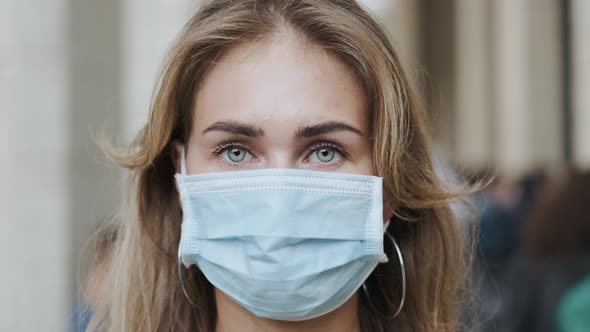Woman in Masks Looking at Camera Closeup People Coronavirus Covid-19. Portrait. alt