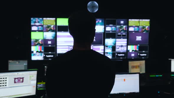 Man Manages the Process in TV Control Room