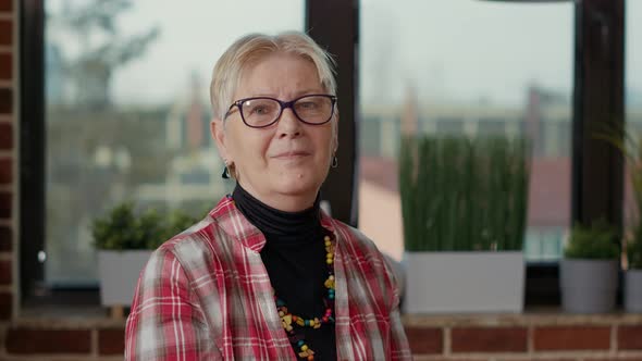 Portrait of Senior Artist Teaching Drawing Technique at Workshop alt