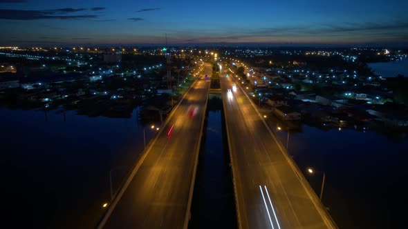 4K Hyper lapse : Drone fly over the bridge and a river. alt
