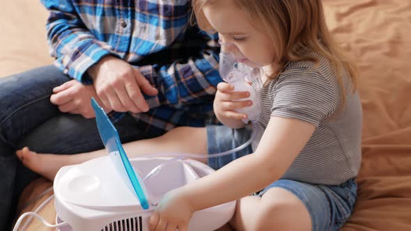 Father Helps His Daughter Use Nebulizer Sick Child Asthma Bronchitis Lung Disease