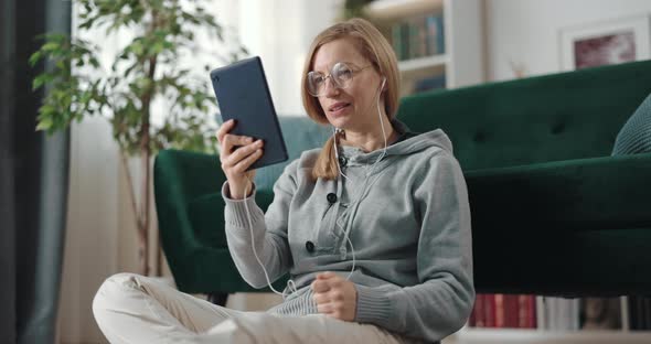Woman Having Video Call on Tablet
